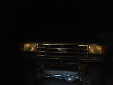 1994 Ford F-150 - Front view of a 1994 Ford F-150, showing its distinctive grille and headlight design.