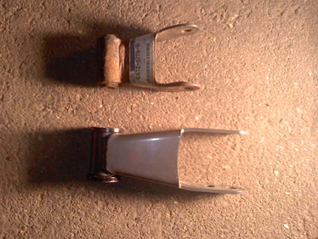 Leaf spring shackle with part number E6TZ-5776-B and a bolt, next to another shackle
