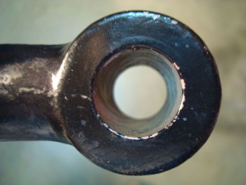 1995 Ford Bronco - A close-up view of a metal component, likely a part of a vehicle's suspension or drivetrain, showing signs of wear and use.
