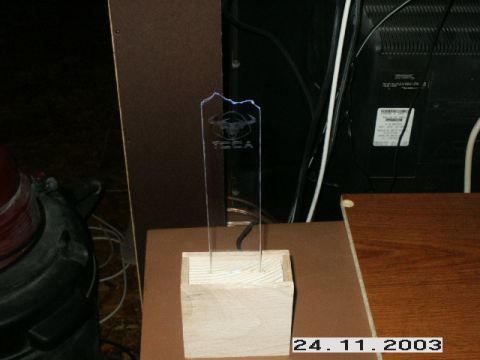 1998 Mercury Sable - An acrylic trophy with a bull logo and the word 'TECA' is displayed on a wooden surface.