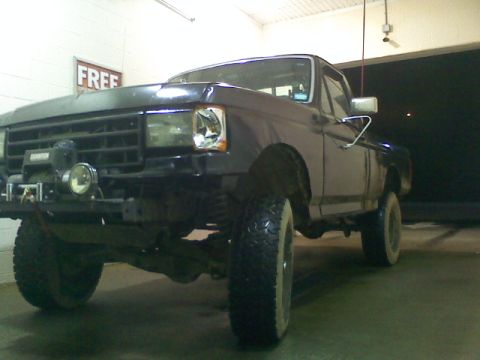 1994 Ford F-150 - This 1994 Ford F-150 features large off-road tires and a front-mounted winch.