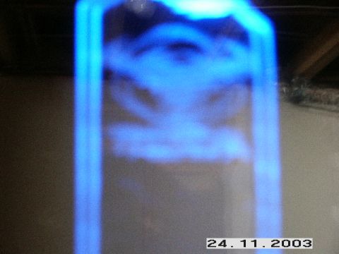 1998 Mercury Sable - Unclear image shows blue light on an object, with website text at the bottom.