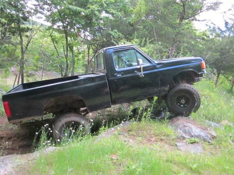 1994 Ford F-150 - This pickup truck appears to be from the late 1980s, not a 1994 model as claimed.