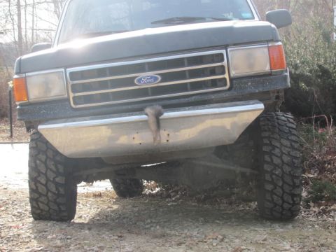 1994 Ford F-150 - This Ford truck features a prominent grille and a custom bumper, with large tires suggesting off-road capability.