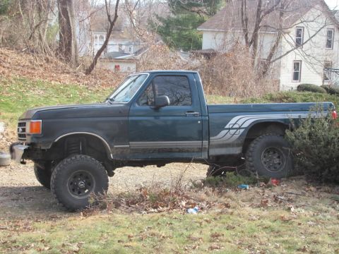 1994 Ford F-150 - This pickup truck appears to be from the early to mid-1990s, not a 1994 model as claimed.