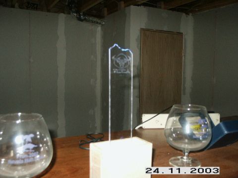 1998 Mercury Sable - A clear trophy with the text 'VEGA' and a bull logo is displayed on a table.