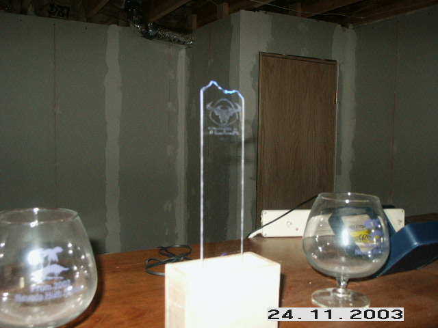 Clear trophy with 'VEGA' text and a bull logo