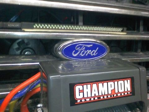1994 Ford F-150 - Close-up of a 1994 Ford F-150 grille the Ford emblem and a Champion winch.