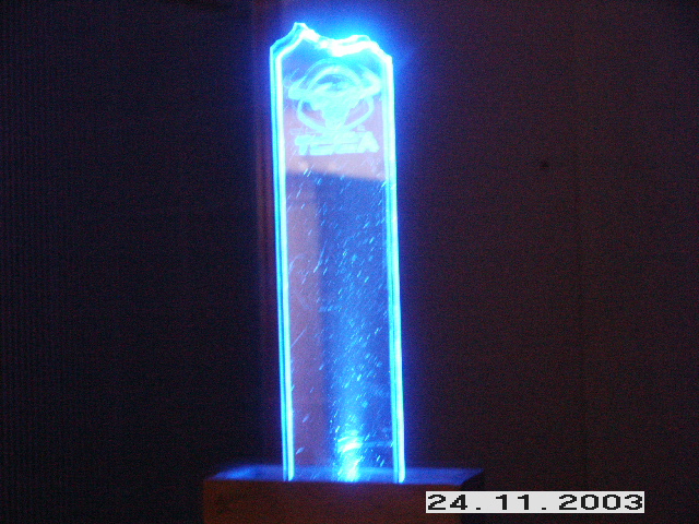 Illuminated trophy with a logo and text, possibly from a car show