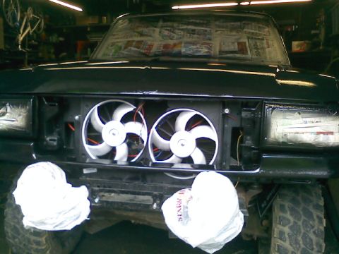 1994 Ford F-150 - Front view of a 1994 Ford F-150 with custom electric fans mounted in the grille area.