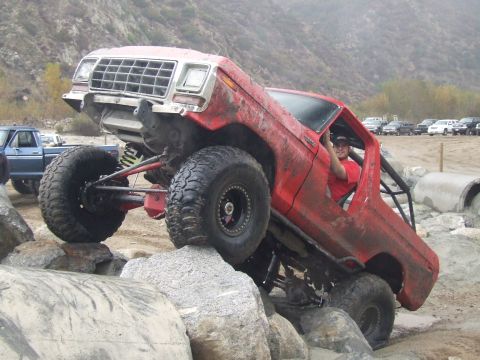1978 Ford Bronco - This modified 1978 Ford Bronco navigates a challenging rocky terrain, its off-road capabilities.