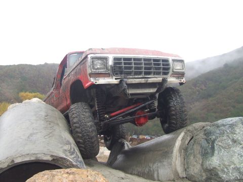 1978 Ford Bronco - This heavily modified 1978 Ford Bronco is navigating a challenging off-road obstacle course.