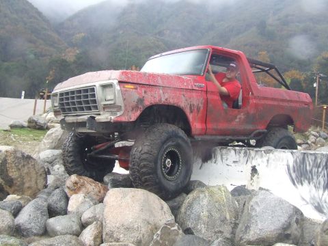 1978 Ford Bronco - 1978 Ford Bronco navigating a rocky obstacle course.