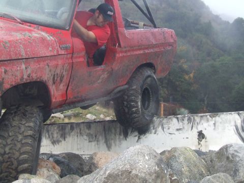 1978 Ford Bronco - 1978 Ford Bronco navigating a rocky obstacle course.