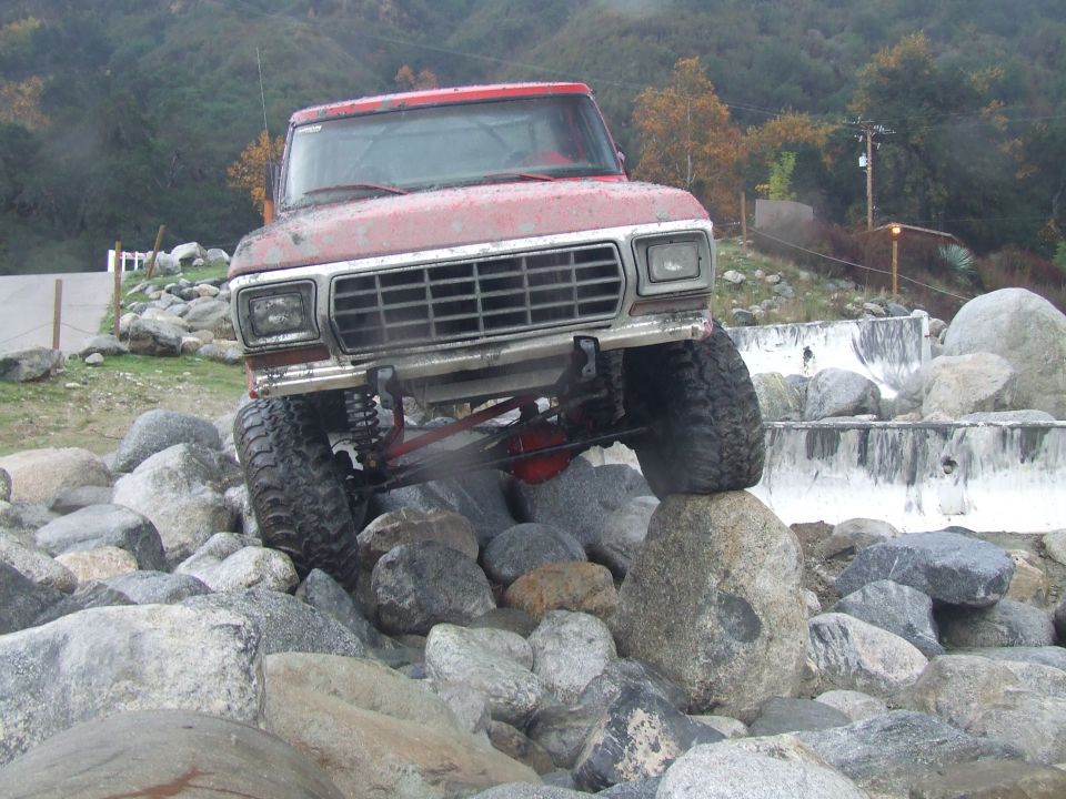 1978 Ford Bronco front view navigating rocky terrain