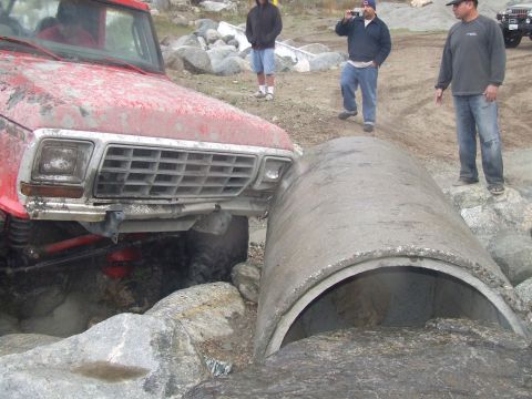 1978 Ford Bronco - 1978 Ford Bronco attempts to drive over a large concrete culvert pipe during an off-road excursion.