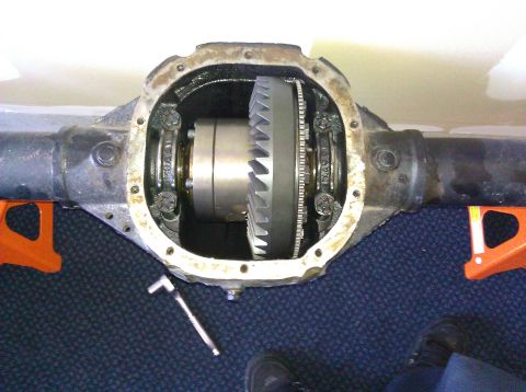 1995 Ford Bronco - Differential housing with gears exposed, resting on jack stands.
