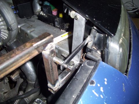 1995 Ford Probe - Custom bracketry installed in engine bay, near fuse box and headlight.