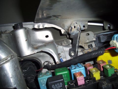 1995 Ford Probe - Close-up view of automotive electrical components and metalwork within the engine bay.