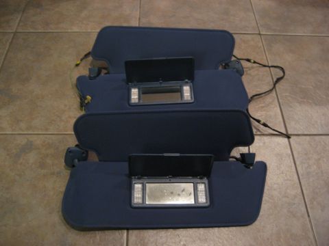 1994 Ford F-150 - These are car sun visors with illuminated vanity mirrors, not a 1994 Ford F-150.