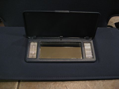 1994 Ford F-150 - Sun visor with illuminated vanity mirror, part of a vehicle's interior.