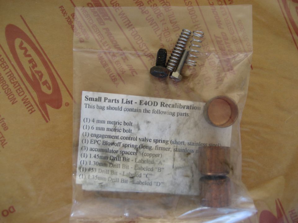 E4OD recalibration parts kit with bolts, springs, and copper spacers