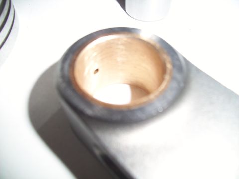 1995 Ford Probe - A metal component with a brass bearing insert is shown in detail.