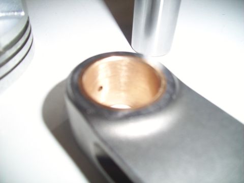 1995 Ford Probe - Close-up of a connecting rod bearing, showing the oil hole. The registry label for this image is incorrect.