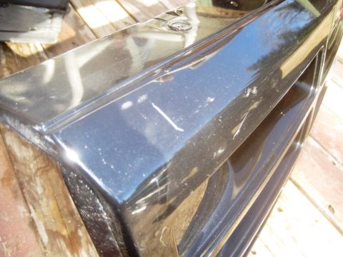 1993 Ford Bronco - A close-up of a black car grille shows signs of wear and tear.