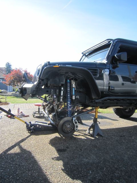 2008 Jeep Wrangler - Jeep Wrangler undergoing suspension work with front fender removed.