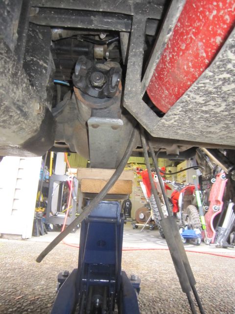 2008 Jeep Wrangler - Undercarriage view of a vehicle's drivetrain components, including a driveshaft and differential.