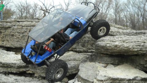 1967 Ford Mustang - This custom buggy navigates a challenging rocky terrain, demonstrating its off-road capabilities.