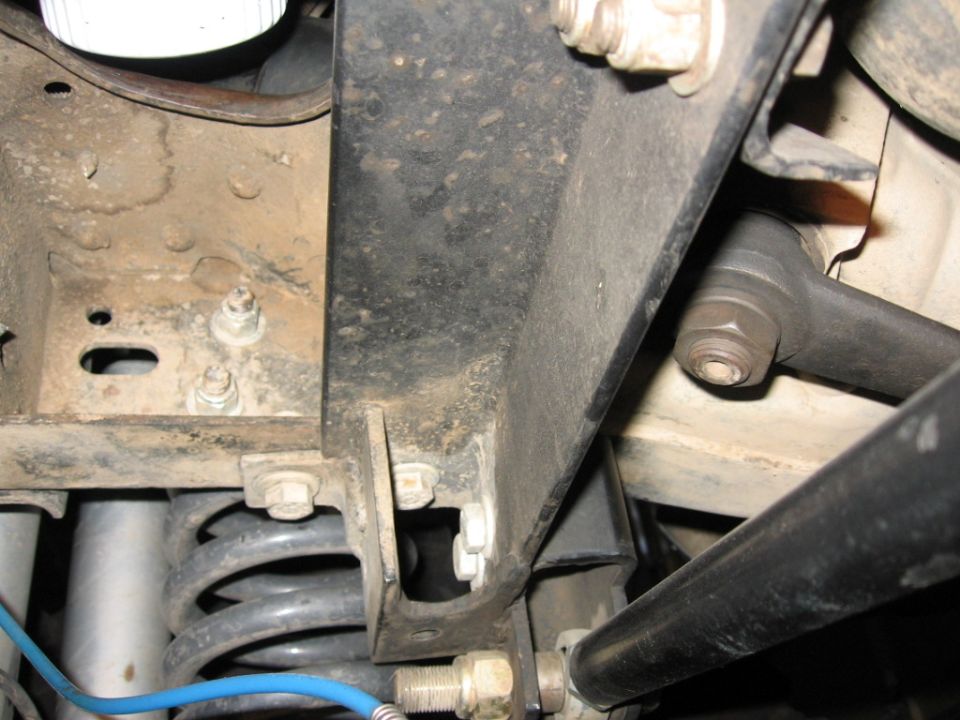 looking up at the bolts for the upper trackbar to frame mount.