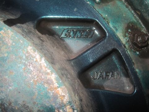 1993 Ford Bronco - Wheel part with 'ENKEI' and 'JAPAN' stamped into it.