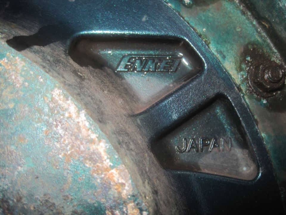 Close-up of a wheel showing 'ENKEI' and 'JAPAN' markings