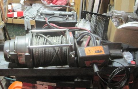 1993 Ford Bronco - A winch and battery are shown, likely for sale as parts.