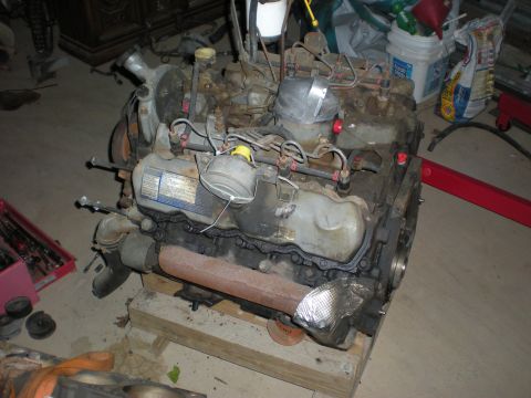 1986 Ford Bronco - This engine appears to be a Ford 7.3L IDI V8, likely from the 1980s or 1990s, resting on wooden supports.