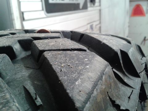 1978 Ford F-150 - A close-up view of a tire tread shows its aggressive pattern and a penny for scale.
