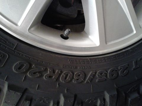 1978 Ford F-150 - Tire and wheel detail, showing tire size and alloy wheel design.