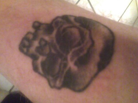 2003 Ford Crown Victoria - This is a tattoo of a skull on a person's skin.