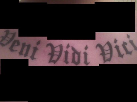 2003 Ford Crown Victoria - Tattoo with the phrase 'Veni Vidi Vici' is visible on skin.