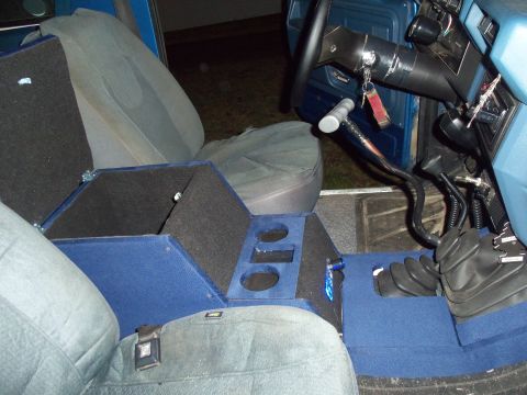 1985 Ford Bronco - Custom console and floor shifter visible inside a vehicle's interior.
