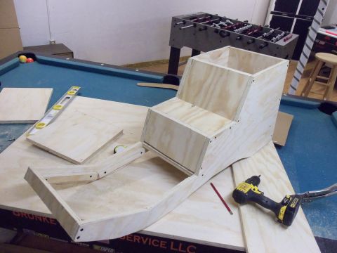 1985 Ford Bronco - Plywood construction project underway on a pool table, with tools nearby.