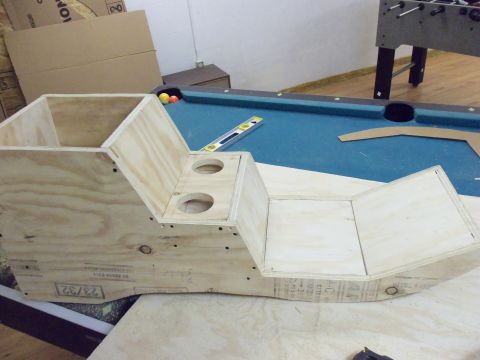 1985 Ford Bronco - A custom wooden center console is under construction, placed near a pool table and foosball table.