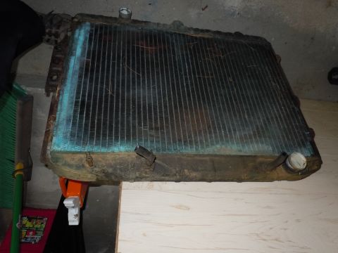 2001 Ford Crown Victoria - A used radiator, showing signs of age and corrosion, is presented for inspection.