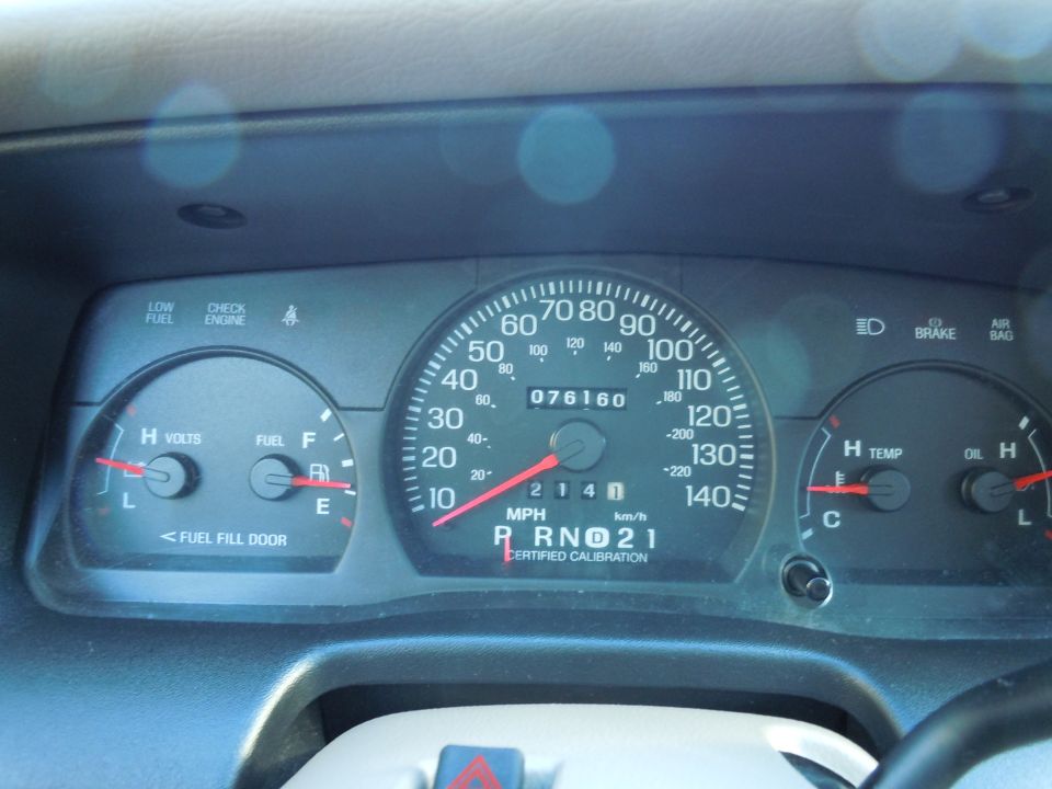 Dashboard gauges showing 76160 miles, fuel, temperature, and oil levels