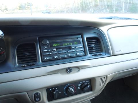 2001 Ford Crown Victoria - Interior view of a 2001 Ford Crown Victoria, showing the dashboard, radio, and climate controls.