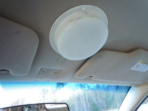 2001 Ford Crown Victoria - Vehicle interior shows an overhead light fixture and sun visors.