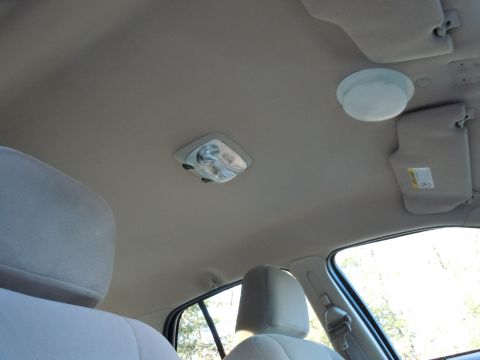 2001 Ford Crown Victoria - Car interior showing the ceiling, dome lights, and sun visors.