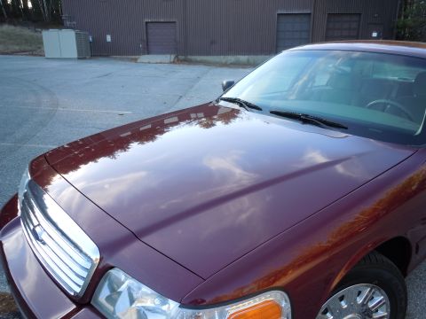 2001 Ford Crown Victoria - This 2001 Ford Crown Victoria is seen from a 3q front angle, its maroon paint.
